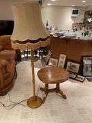 Basement. Wooden base standing lamp and matching small side table approximately 24 inches tall.