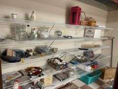 Contents of white shelves include some craft supplies, tins, miscellaneous.