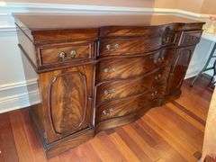 Dining room. Ornate Cherrywood finish 62 inches long 35 inches high 20 inches deep. Burl front veneers.  Not marked but assume same company as china cabinet.  One handle was missing.