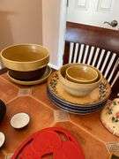 Kitchen. Over and back yellow Ware, bowls. Tea kettle with small tea, cups, and miscellaneous.