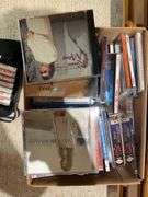 Basement. Contents of cabinet, which include VHS tapes with some well-known movies. Cassettes and CDs. Large assortment.