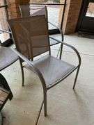 Outdoor set includes four chairs and round table also includes three miscellaneous outdoor side chairs