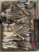 Lot of flatware. In dining room.