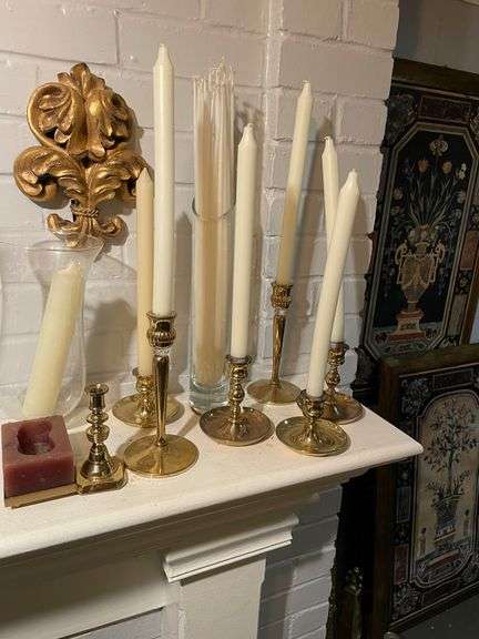 Selection of brass candle holders some are Baldwin brass on mantle
