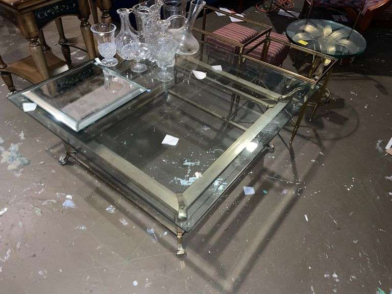Large brass and glass coffee table, miscellaneous table framed. Unique round brass table and small foot stools. All for one money.