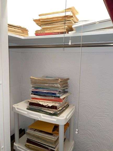 Contents of closet includes sheet music.