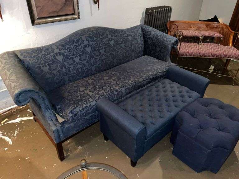 Camelback sofa, dressing bench, and ottoman. Basement.