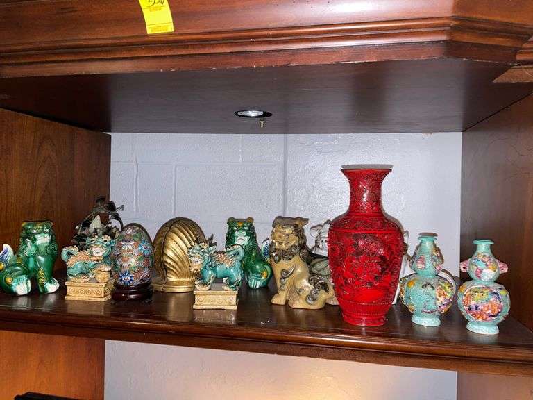 Selection of Asian decor includes Fu dogs.