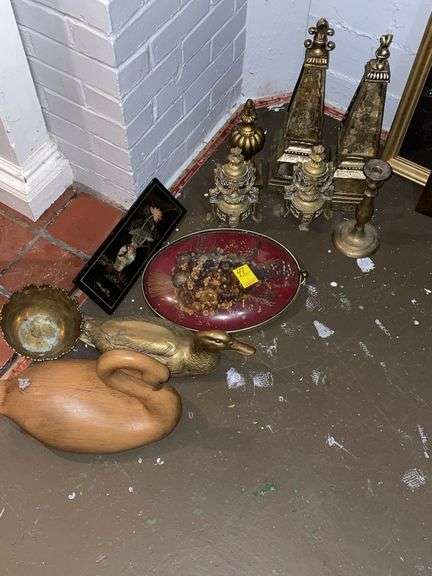 A lot of decor includes brass duck, wood duck, and miscellaneous