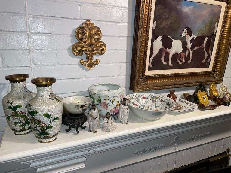 Asian decor and pieces on left mantle.
