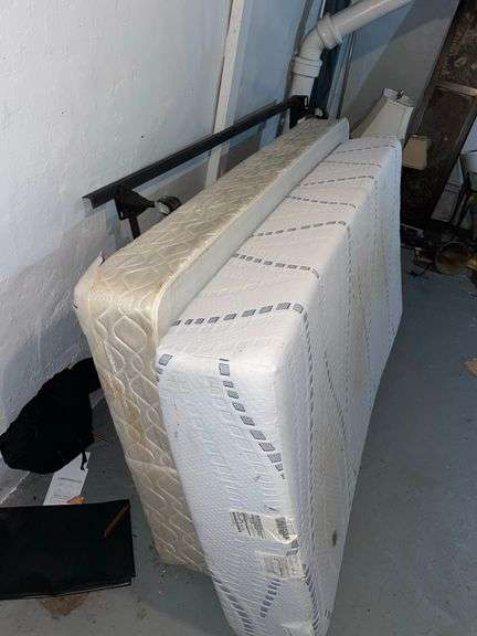 Heavy foam single bed with box springs and bedframe appears in decent condition