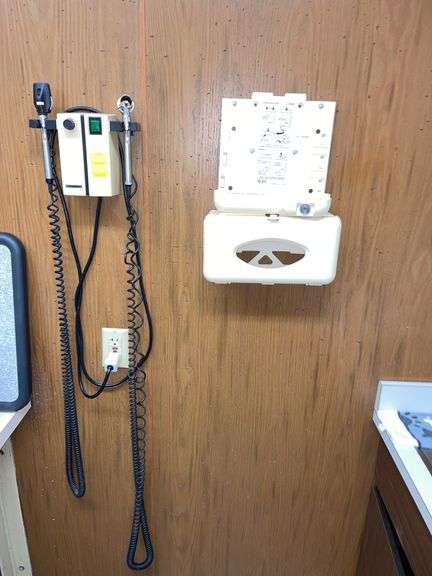 Wall mounted exam unit and glove dispenser.