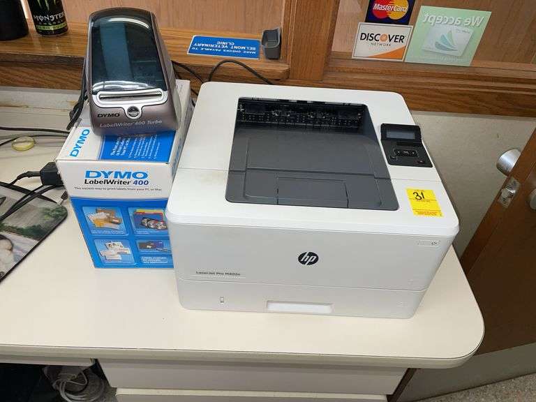 HP LaserJet pro printer and dynamo label printer with box