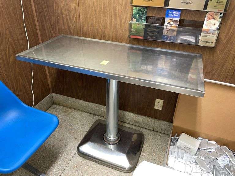 Stainless steel pedestal exam table 45” x 20”. Heavy and vintage.
