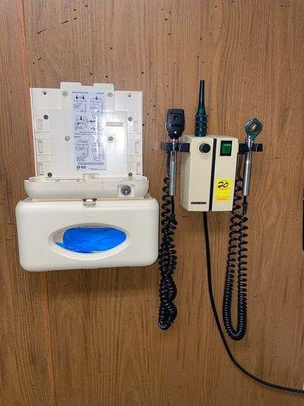 Wall mount exam unit with glove dispenser.