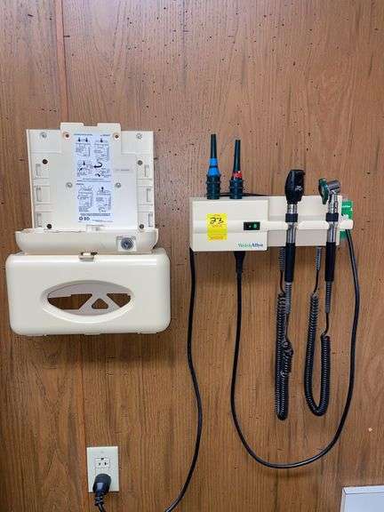 Wall mounted exam unit and glove dispenser.