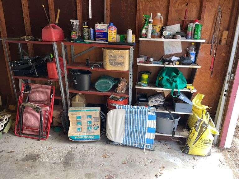 Contents of right side of the garage includes three shelving units, chemicals, some tools, salt, gas cans. Take what you want and leave the rest.