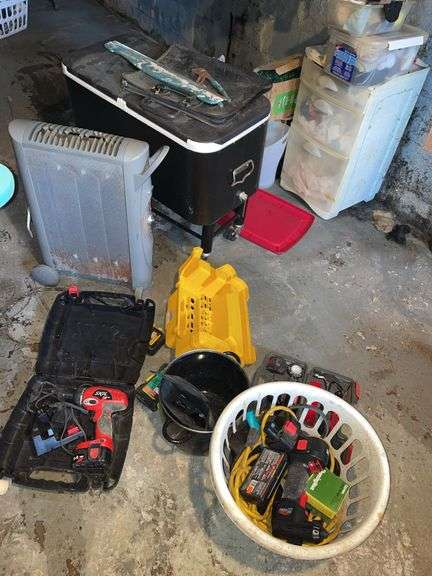 Basement laundry area includes some tools, skill, battery powered unit, cooler on casters and miscellaneous. Take what you want. Leave the rest note there is some mildew