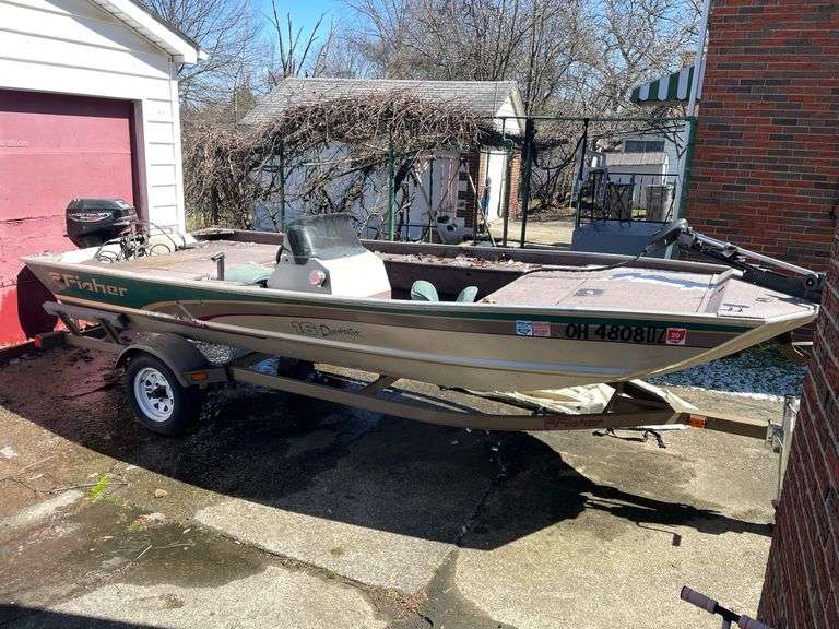 Fisher 16' Dominator Fishing Boat with Mercury Four Stroke 9.9 Engine on Trailer.