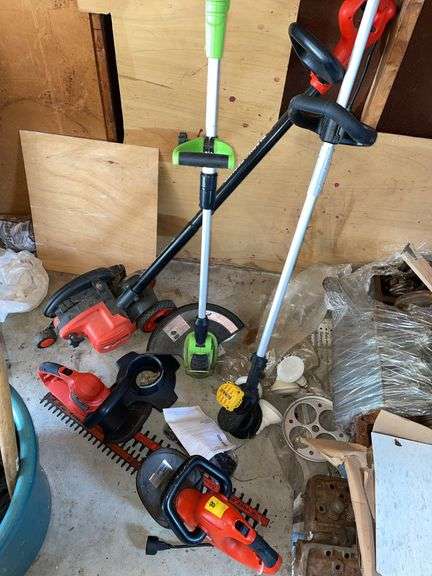 Large lot of garden hand tools includes two electric trimmers, Black & Decker, edger, electric string, trimmer, and cordless DeWalt string trimmer no battery