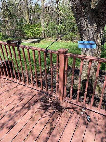 Deck. Birdbath with Eco cycle birdfeeder on hook and light up faux branches.