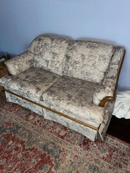 Den. Well-made loveseat approximately 60 inches wide. Cushions feel firm 