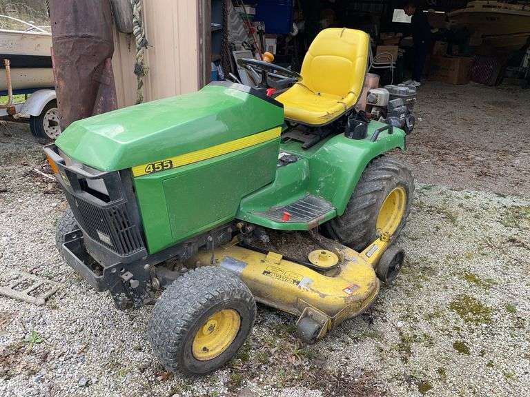 John Deere 455 riding mower with 60 inch deck. What appears to be 1800 hours on the meter. Includes cub cadet track vac pull behind system with 5.5 hp Briggs & Stratton motor. The John Deere started right up at inspection.