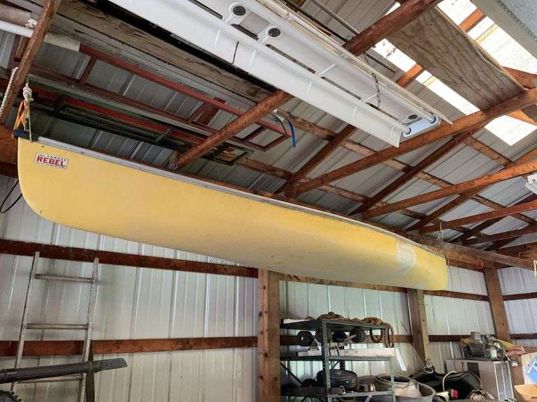 Yankee rebel fiberglass canoe. Appears to have had a repair. Bring ladder to remove.