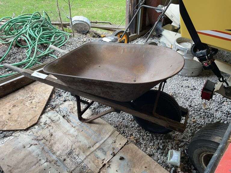 Very heavy duty metal wheelbarrow with pneumatic tire that is inflated in good condition.