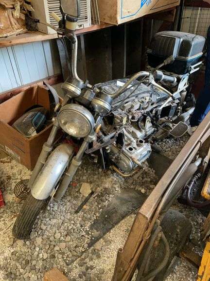 Honda GL 1000 motorcycle with several parts and accessories. No title. This bike is Parts only. Show shows 22,000 miles on odometer.