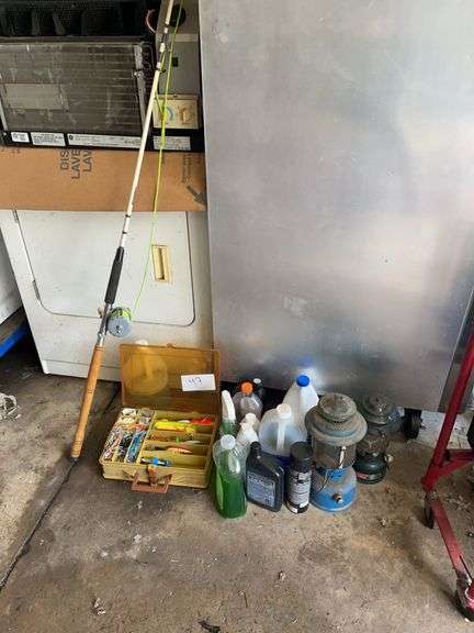 Excellent Fishing lot includes large ocean reel, Tale box with expensive lures. Also includes two lanterns and household chemicals and oil.