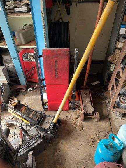 Auto lot includes 4 ton craftsman jack in working condition, creeper, battery charger and jackstand. Extra one and a quarter ton jack does not lift.