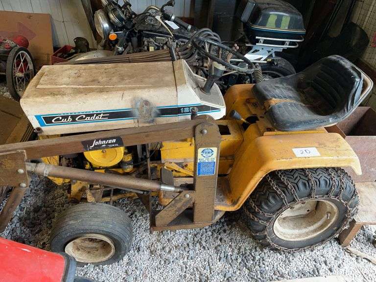 Cub cadet model 126 lawn tractor with hydraulic front end loader and chains. We believe that the blade for this is in another lot selling later in the auction.