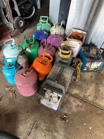 Refrigerant lot includes national refrigerator, products, recovery unit, pump, vacuum pump. Miscellaneous refrigerant canisters