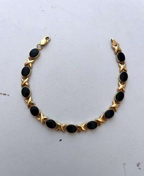 Ladies bracelet marked 14 K. With semi precious stones throughout. Total weight 7.0 g.