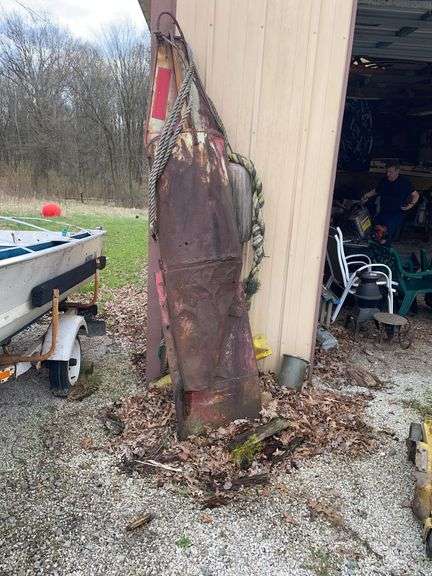 Vintage buoy, approximately 7 feet tall.