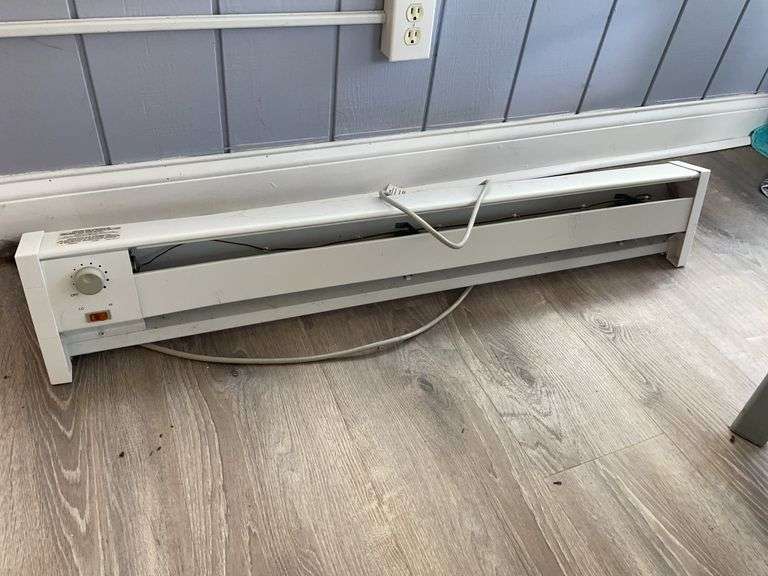 Florida room. Plug in electric heater. 45 inches across. Powered on.