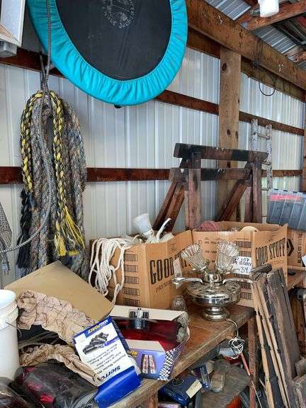 Sawhorses and heavy rope with miscellaneous ceiling fans. Also includes truck tail lights.