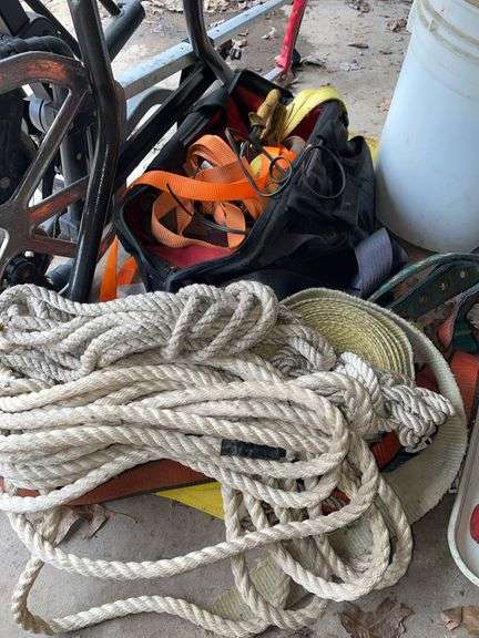 Lot of straps various rope in the bag that is holding a lot of the straps