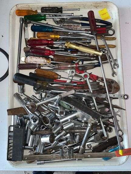 Lots of tools. Include sockets nut drivers, wrenches, and miscellaneous.