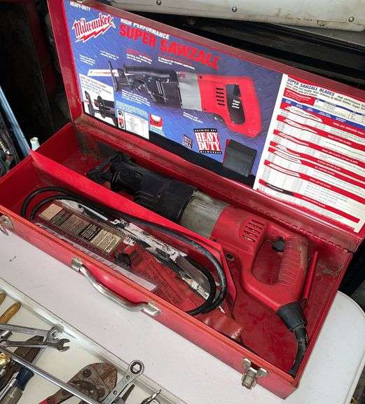 Milwaukee super sawzall in metal case. Includes blades.