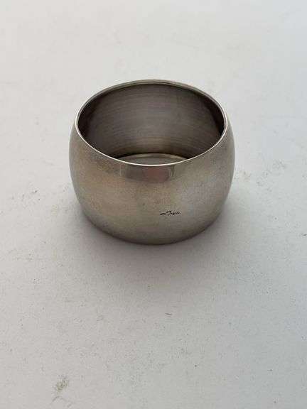 What appears to be a Napkin Center Loop. Unknown if this is a sterling piece. Total weight 10.5 g. See photos for marking on it. Best to inspect at Preview.