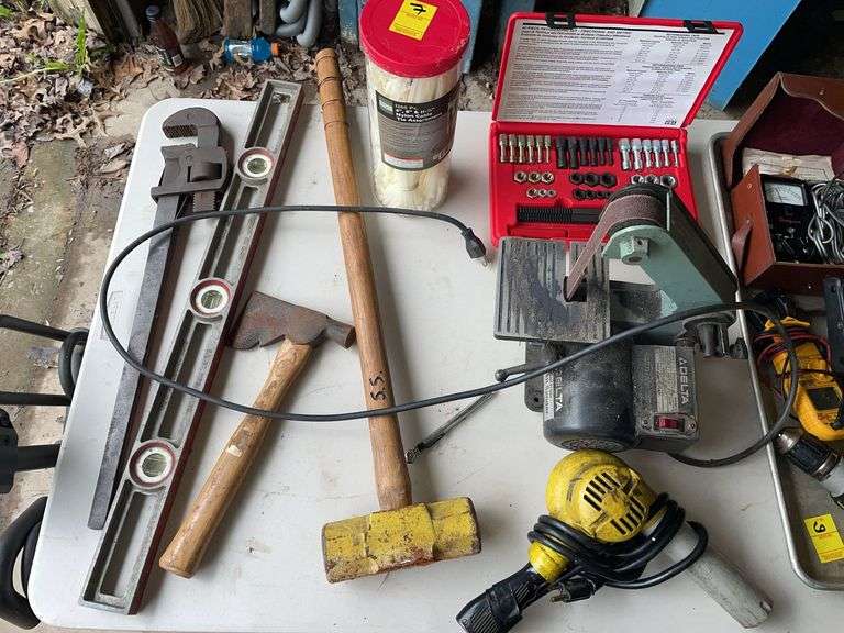 Tool lot. 40 piece rethreading set. Sledgehammer. Large pipe wrench. Nice level. Heat gun. Zip ties.