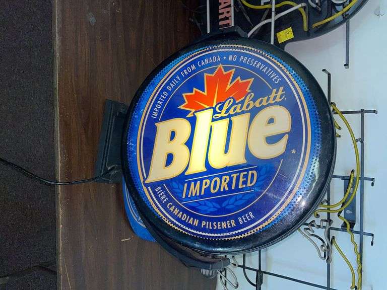 Labat blue rotating light up sign. Lights up and rotates, but the one side keeps falling off. Some loss.