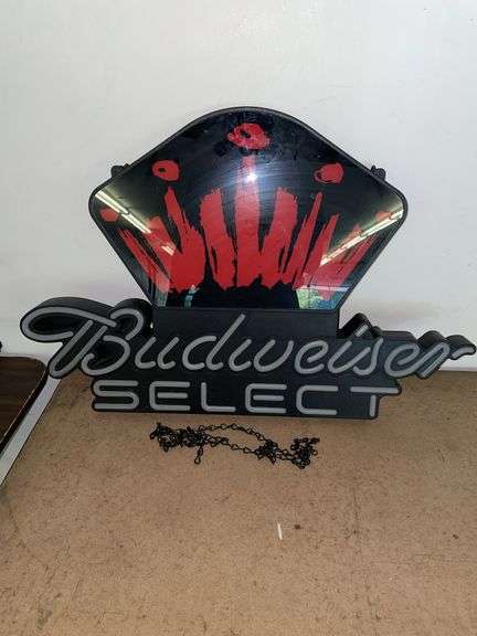 Budweiser select hanging light up sign with chain. Approximately 28 inches across and 19 inches tall. Missing power cable and that will need to be replaced. Sign is in good condition though.