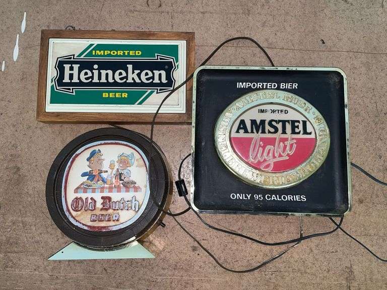 (3) vintage beer signs. None of these signs light up may just need replacement bulbs and the old Dutch beer sign needs a new plug. Featuring Heineken. Amstel light. Old Dutch beer. These signs are on the smaller end with the Amsel being approximately 12 x 12“