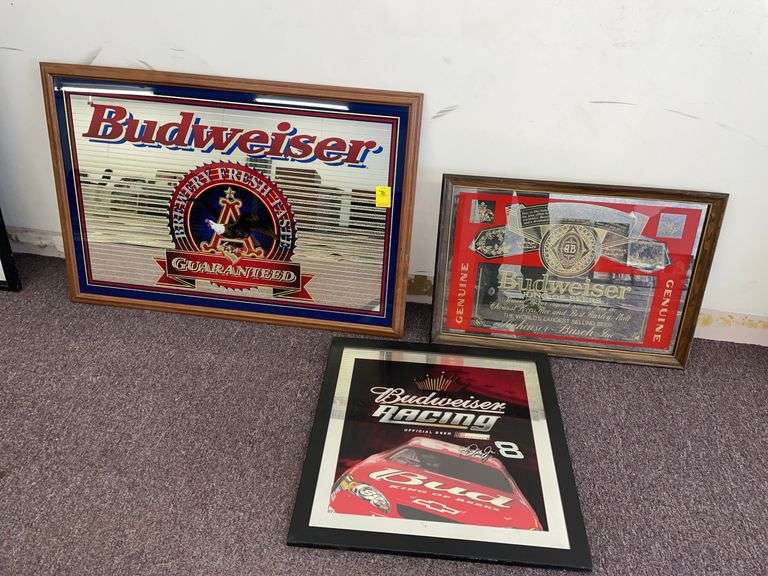 Three Budweiser signs. The largest being approximately 37 x 25”.