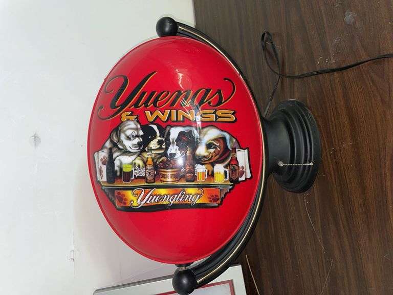 Rotating Yingling sign. YUENGS and wings. Does not light up but rotates and has a wall mount. Approximately 22 inches tall and 16 inches across.