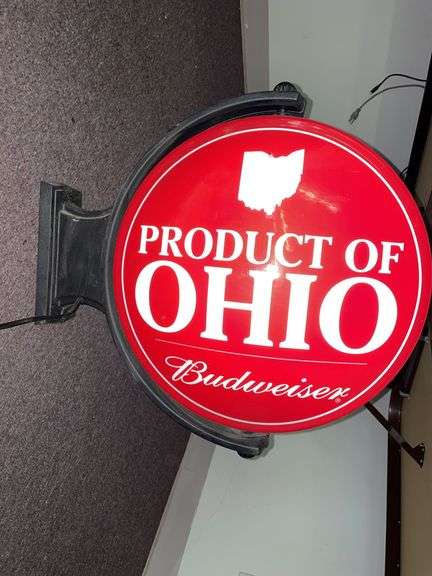 I love Ohio Budweiser rotating light up double sided sign. With wall mount. The sign is approximately 18 inches across. Lights and slowly rotate.