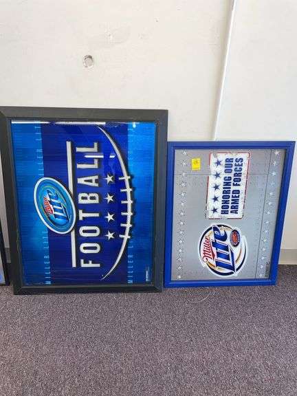 Two Miller light commemorative signs. The largest one is approximately 35 x 28”.
